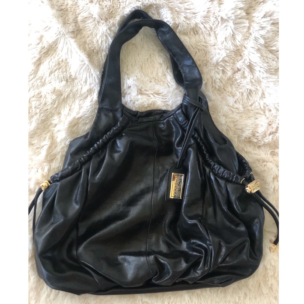 Like new- Badgley Mischka black bag w gold detail.